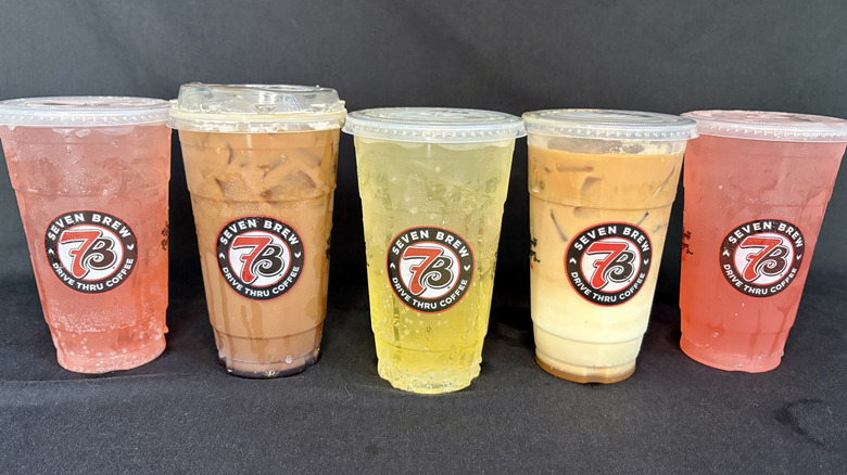 Variety of five 7 Brew beverages in clear cups