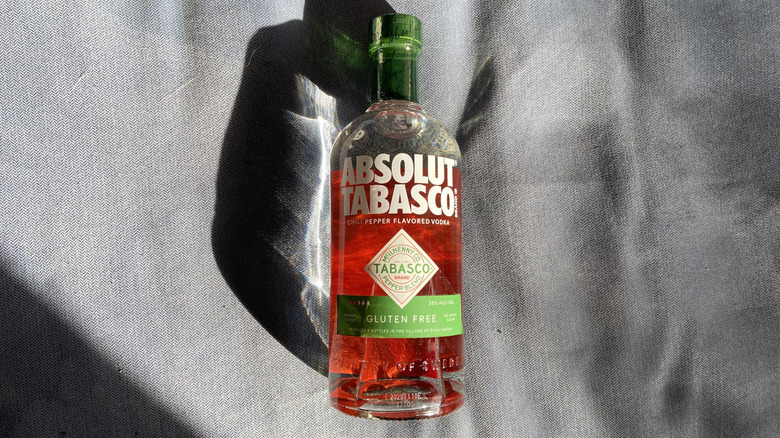 Absolut Tabasco bottle on a blue cushion