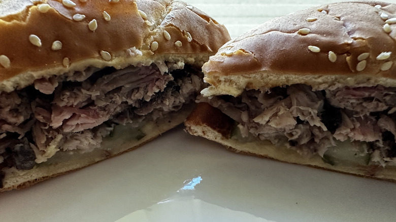 Arby's Quarter Pound brisket sandwich cut in half