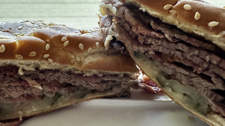 Arby's Quarter Pound brisket sandwich cut in half