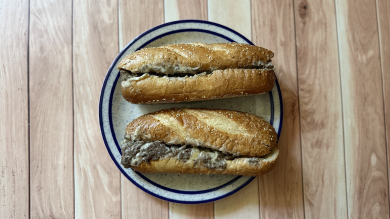 two of Arby's Angus Cheesesteaks on a plate