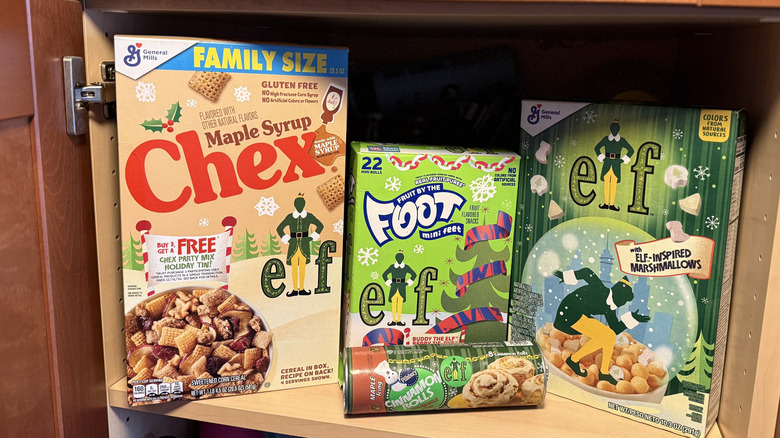 Three Elf-themed cereals on a shelf