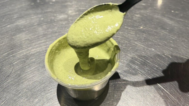 a spoonful of Chipotle's Cilantro Lime Sauce