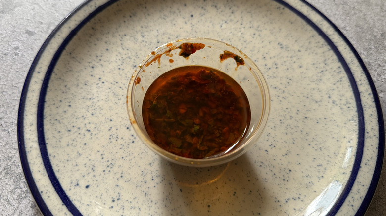 close up of a cup of Red Chimichurri Sauce
