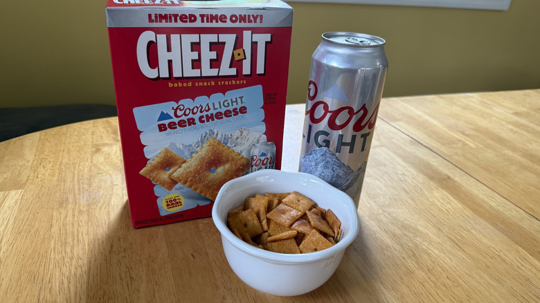 Box of Cheez-It Coors Light Beer Cheese, a bowl of the crackers, and a can of Coors Light