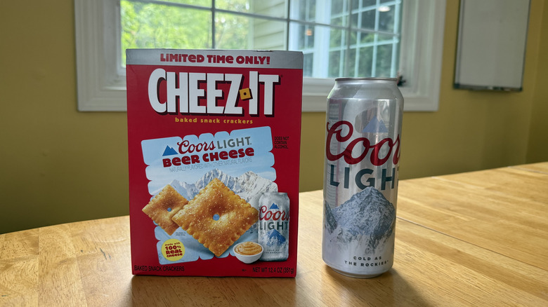 A box of Cheez-It Coors Light Beer Cheese and a can of Coors Light