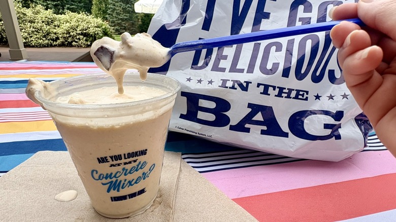 A melty spoonful of Culver's Pumpkin S'mores Concrete Mixer from takeout cup
