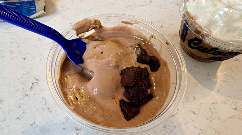 A closeup of Culver's new Peanut Butter Fudge Brownie frozen custard Flavor of the Day in takeout cup