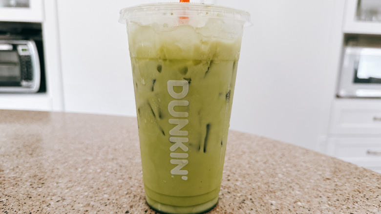 Dunkin' Bananarama Iced Matcha on granite counter