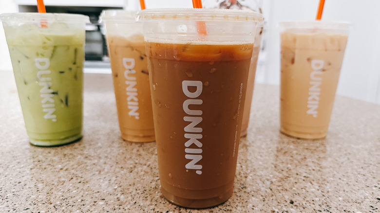 Colorful drinks in Dunkin' plastic cups