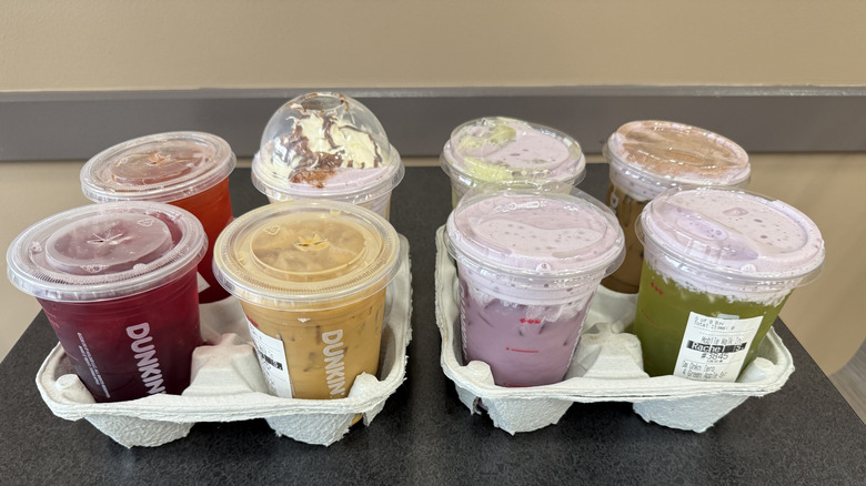 Eight Dunkin' Halloween Drinks in drink holders