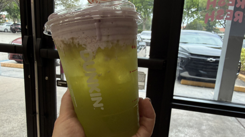 Sour Apple Energy in front of Dunkin' door
