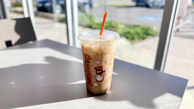 Cookie Butter Oat Iced Chai Latte on the table