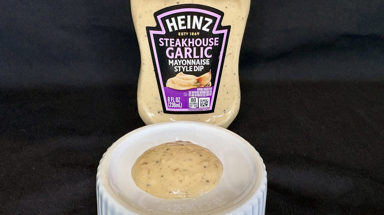 Steakhouse Garlic sauce on white dish with Heinz bottle in background