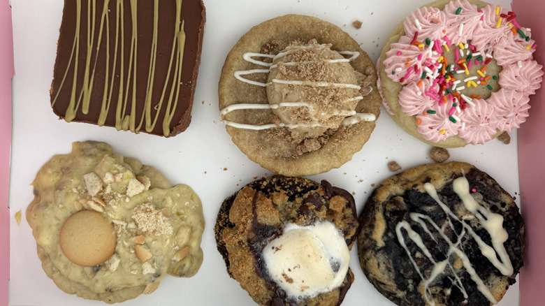 Six different Crumbl cookies in the box