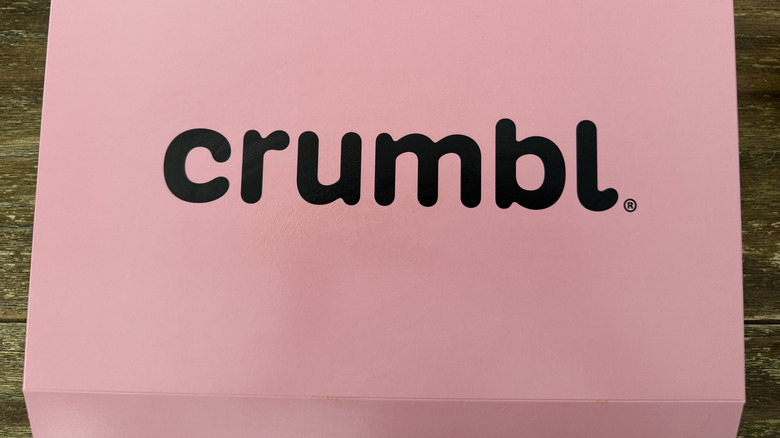 Pink Crumbl box on a table