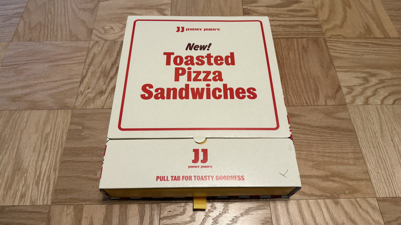 a box holding the Toasted Pizza Sandwiches