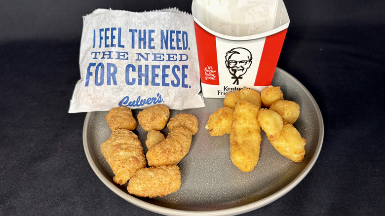KFC and Culver's cheese curds on plate with small paper bag and cardboard sleeve behind