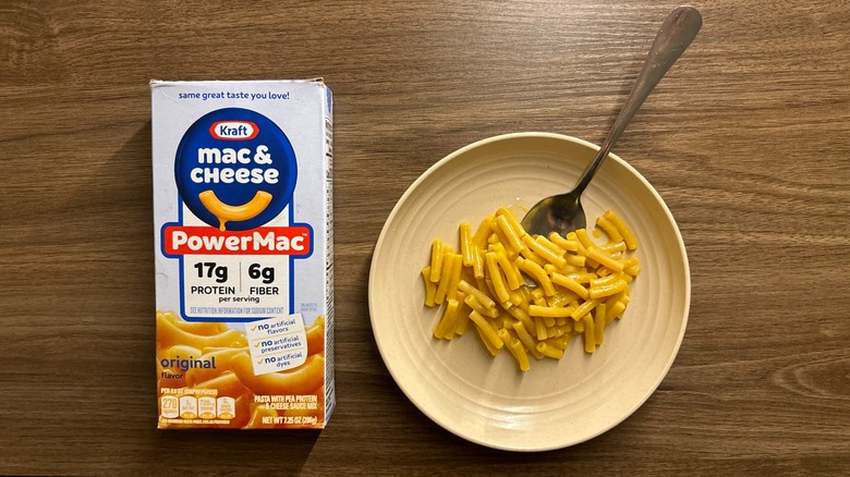 Kraft PowerMac box next to some macaroni and cheese on a plate