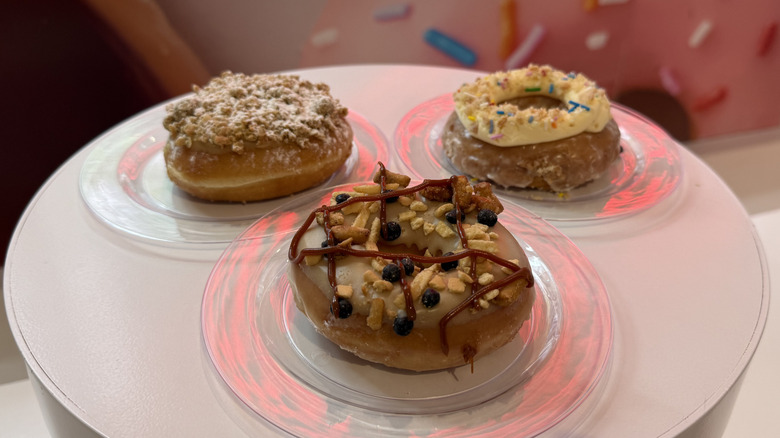 Krispy Kreme x Milk Bar Collection doughnuts on plates