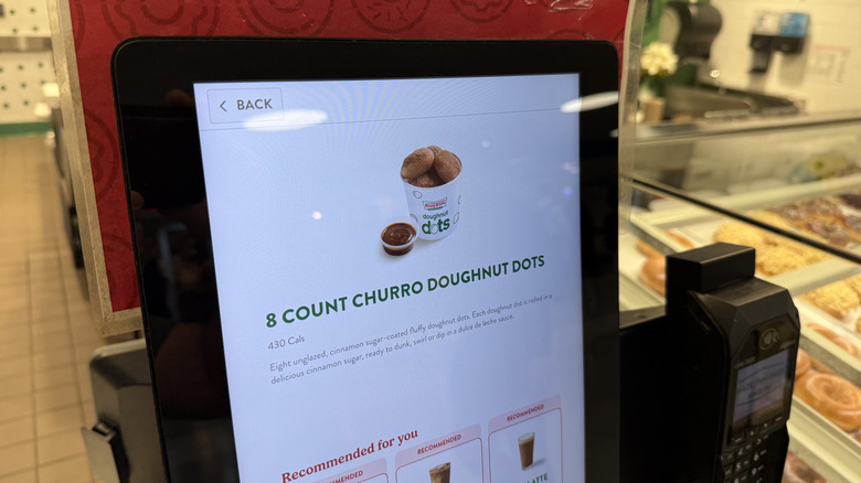 kiosk screen displaying the Krispy Kreme Churro Dot Doughnuts with dulce de leche sauce