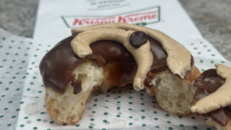 Café Mocha doughnut broken in half to show doughnut texture