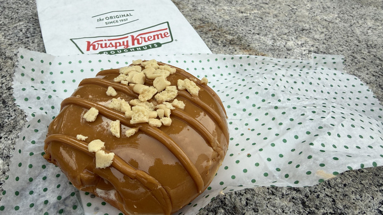 Maple Cheesecake doughnut covered with maple icing and sprinkled with graham-flavored crumbles