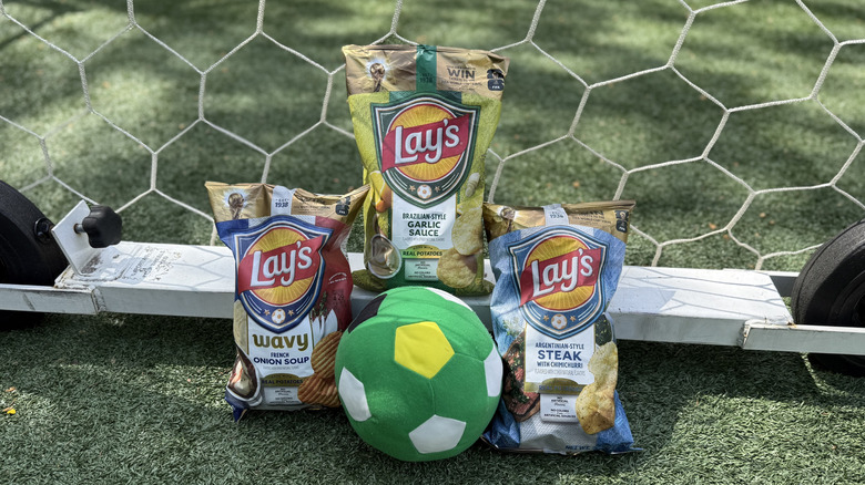 Bags of Lay's World Cup Globally Inspired Flavors and a soccer ball