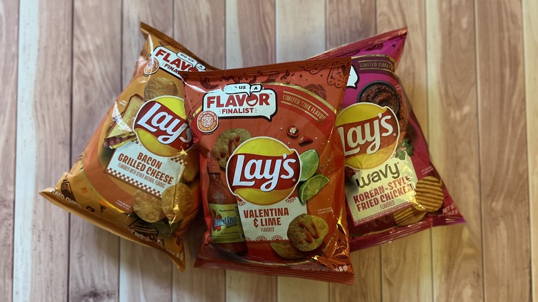 three bags of Lay's chips stacked on each other
