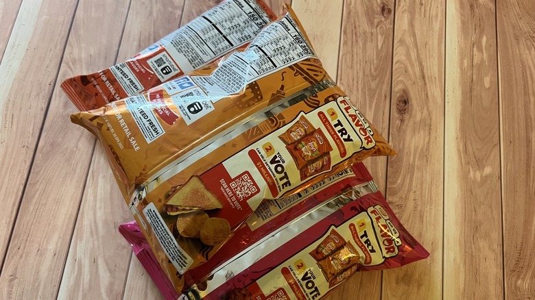 the back of three chip bags