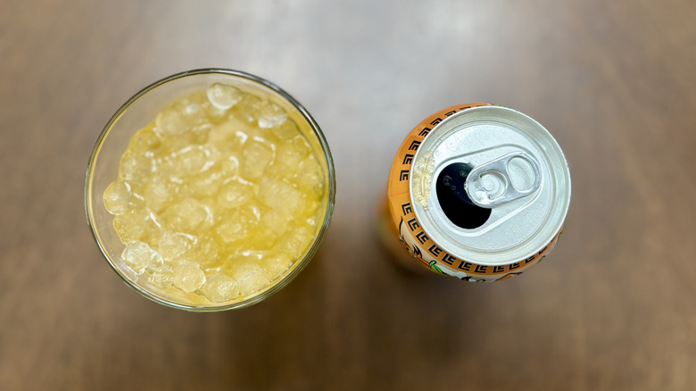 Open can poured over ice
