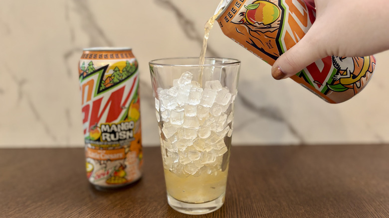 Pouring can of soda