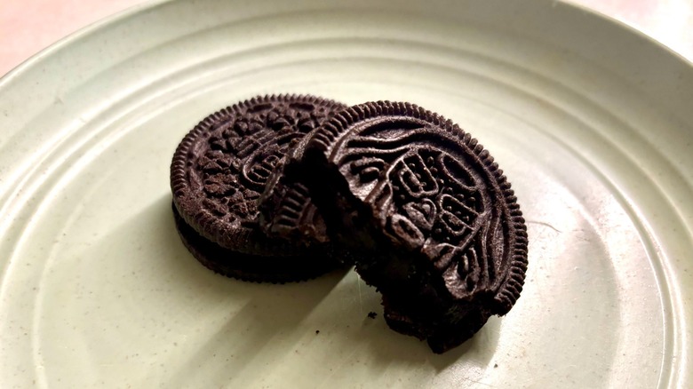 Marvel Oreo Stuf of Doom cookies on a plate, one with a bite taken out of it