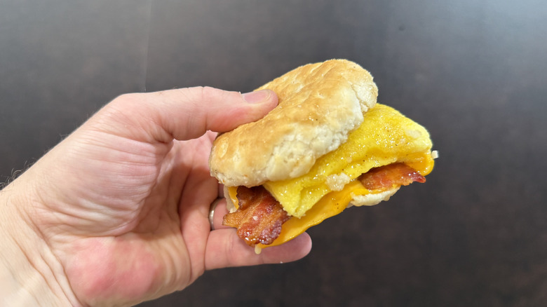 Honey Brown Butter Bacon Egg Cheese Biscuit In hand