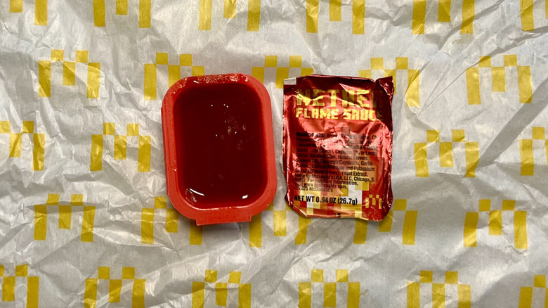 an open cup of McDonald's Nether Flame Sauce