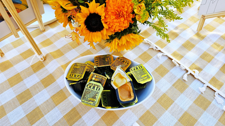 Bowl of Gold Sauces with flowers