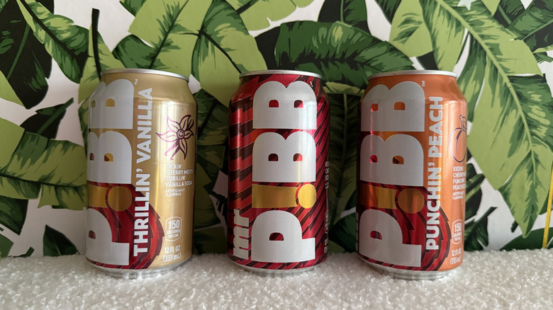 Three cans of Mr. Pibb