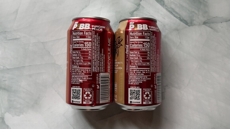 Informational backs of Mr. Pibb cans