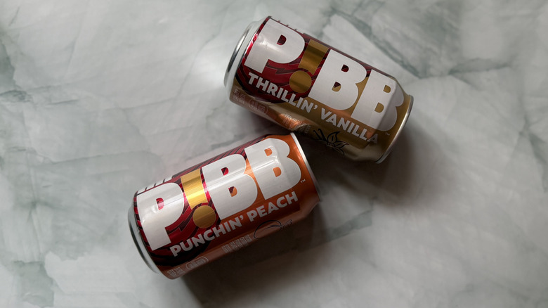 Two cans of Mr. Pibb on angles