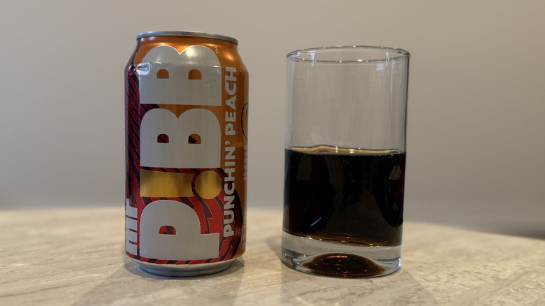 A glass filled with Mr. Pibb Punchin' Peach