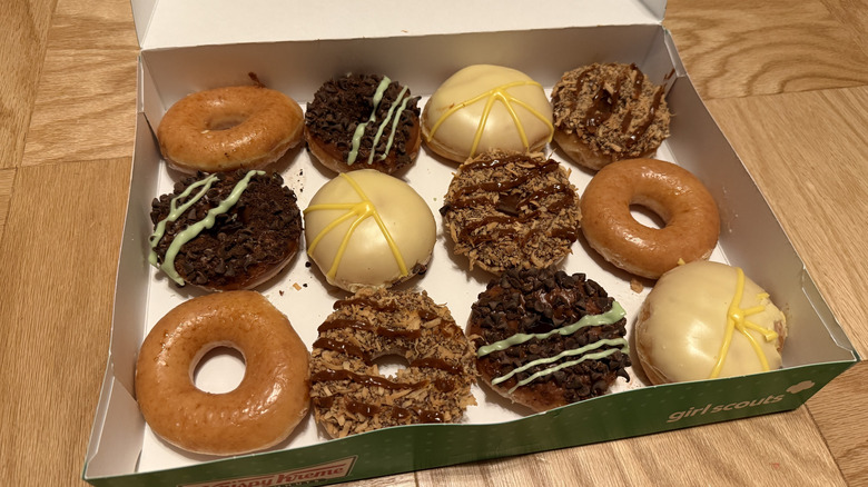 A dozen of Krispy Kreme Girl Scout Cookie inspired doughnuts