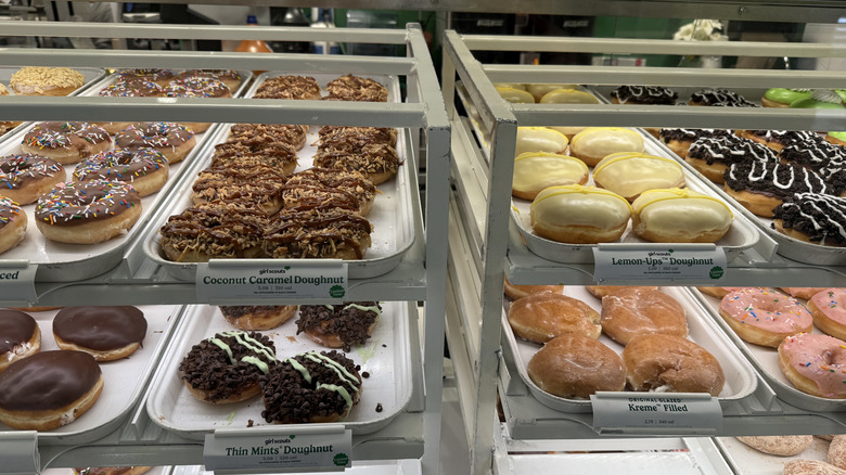 Racks of Krispy Kreme Girl Scout Cookie Inspired Doughnuts