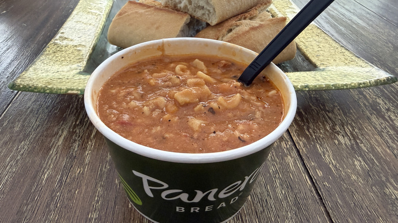 Panera Three-Cheese Lasagna Soup with bread in background on wooden table
