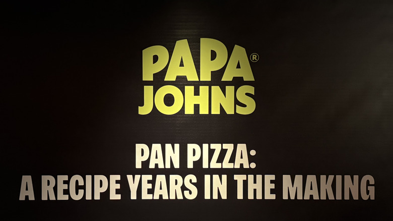 a Papa Johns sign that says Pan Pizza: A Recipe Years In The Making