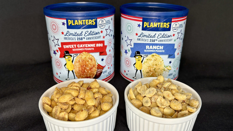 Planters peanut cans behind two white dishes with each flavor of nuts