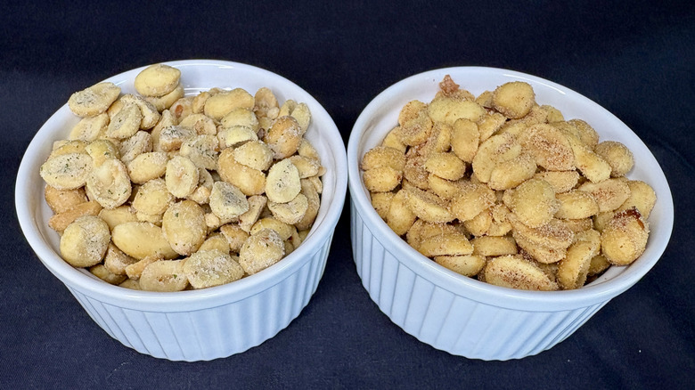Two white dishes of Planters two flavors of seasoned peanuts