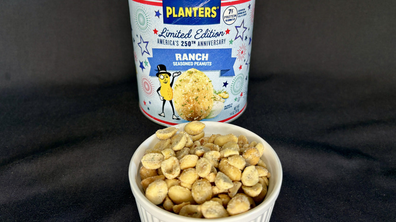 Planters Ranch Seasoned Peanuts can behind a dish of the nuts