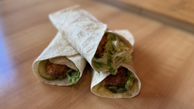 A pile of three Blackened Chicken Wraps by Popeyes