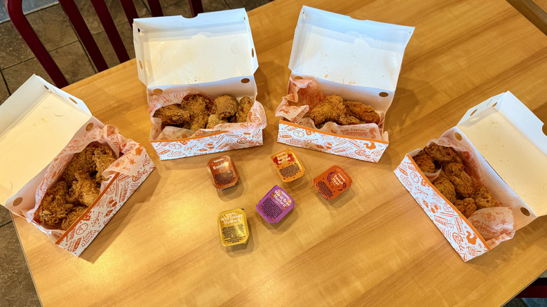 collection of chicken wings with rubs on table