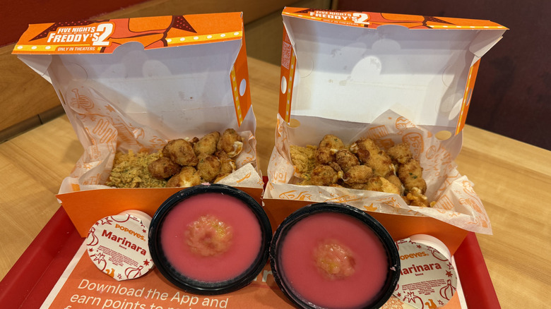 Two open boxes of Popeyes' The Freddy Fazbear Crunch Menu